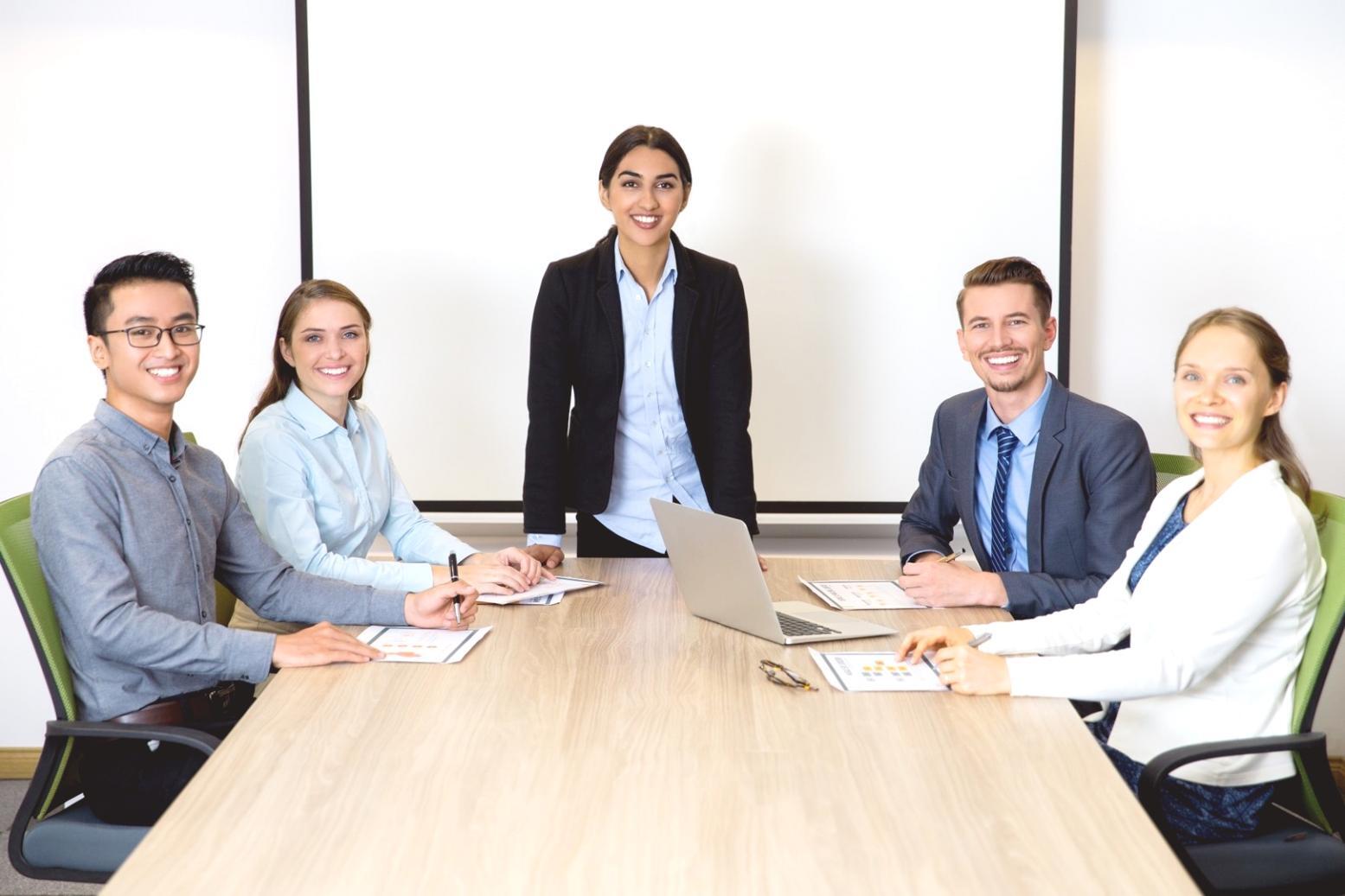Strategic business meeting with partnership documents and planning materials